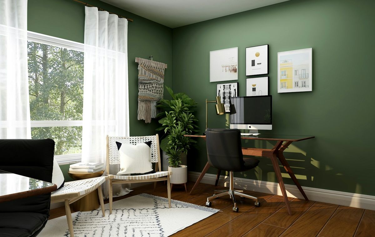 Green home office with desk and reading chair