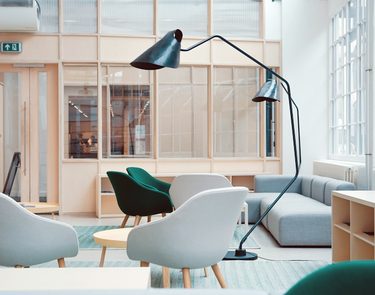 Bright office lounge with designer chairs
